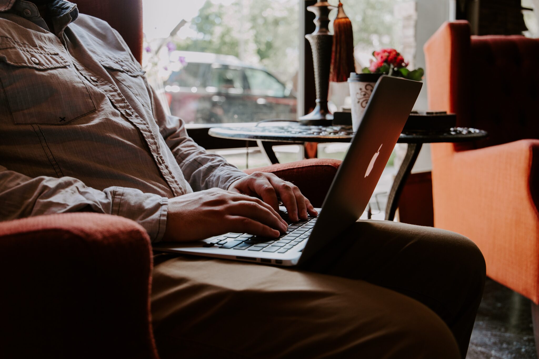 Translation deals with written text, while interpretation is spoken.

A person sitting in an armchair, typing on a macbook, in a coffee shop.